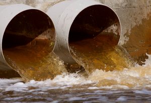 Toxic water running from a sewer to the river